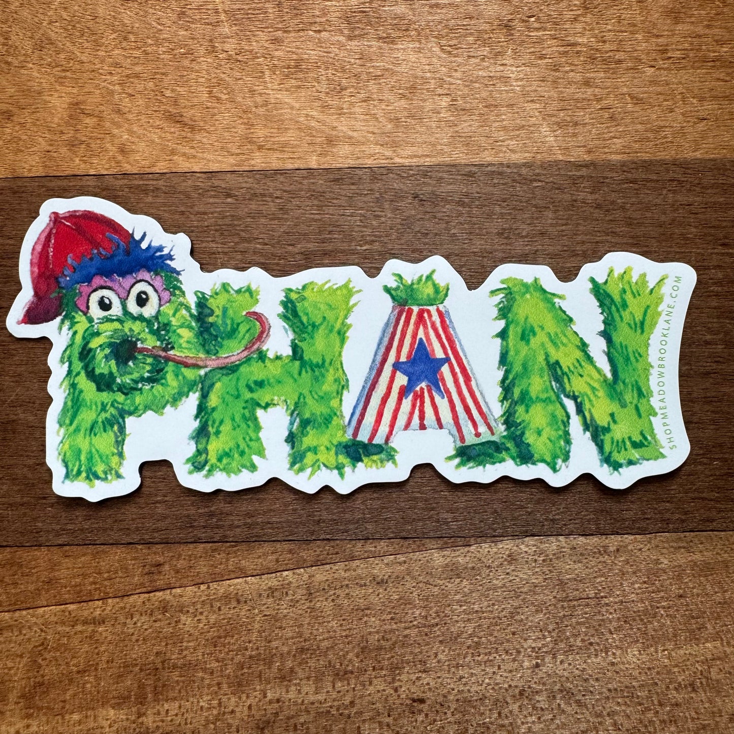 Sticker featuring a green fuzzy character with a red hat and red-and-white striped pants, spelling out "Phan" with letters integrated into the character's shape. Perfect for fans of Philly-themed collectibles.
Transformed Sentence:
Meadowbrook Lane's "Philly Vinyl Magnets" feature a green fuzzy character with a red hat and red-and-white striped pants, cleverly spelling out "Phan" with letters integrated into the character's shape. Ideal for enthusiasts of Philly-themed collectibles.