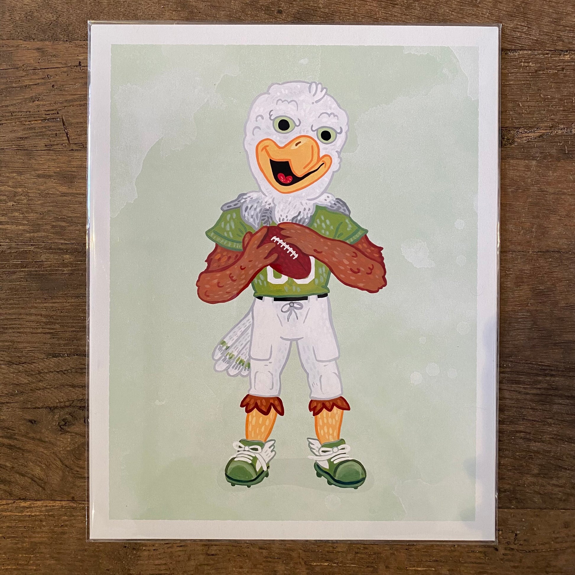 Illustration of an anthropomorphic duck dressed in football attire, holding a football, reminiscent of Philly Mascot Prints by Jamie Bendas gritty essence.