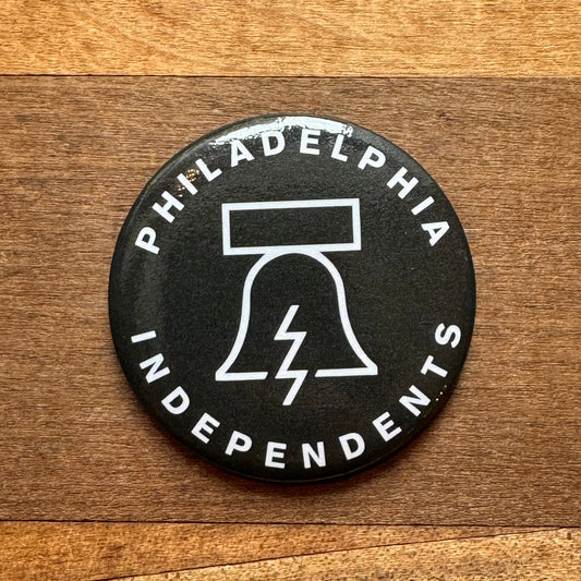 A black and white round magnet featuring the text "Philadelphia Independents" and an image of the Liberty Bell with a lightning bolt is called a Philadelphia Independents Bell & Bolt Magnet.