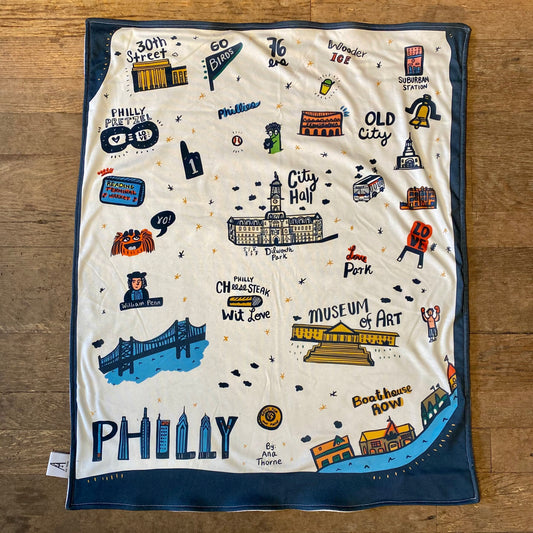 Illustrated Philly print scarf featuring iconic landmarks and cultural references of Philadelphia, crafted from organic cotton.