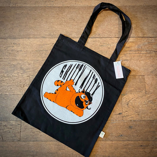 A Gritty Kitty tote bag featuring a hand-screenprinted graphic of Garfield the cat lying down, with white and orange stripes resembling a barcode behind him by Slapstik.
