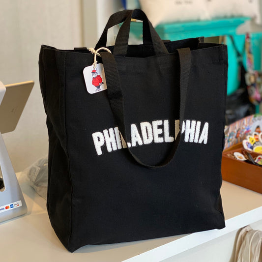 Black canvas Philadelphia Patch tote bag with the word 