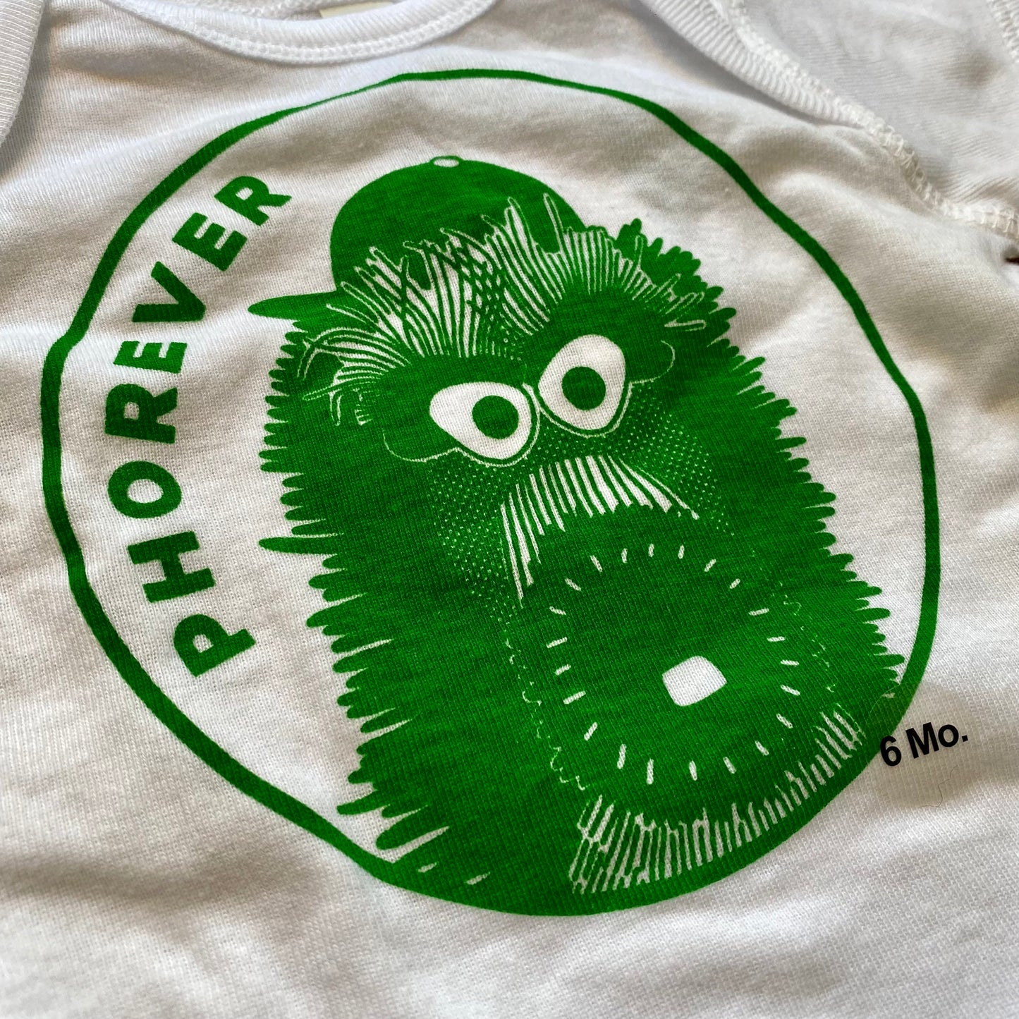 Green cartoonish Phanatic Phorever Baby Onesie with the pun "Phorever Phan" on a baby onesie by exit343design.
