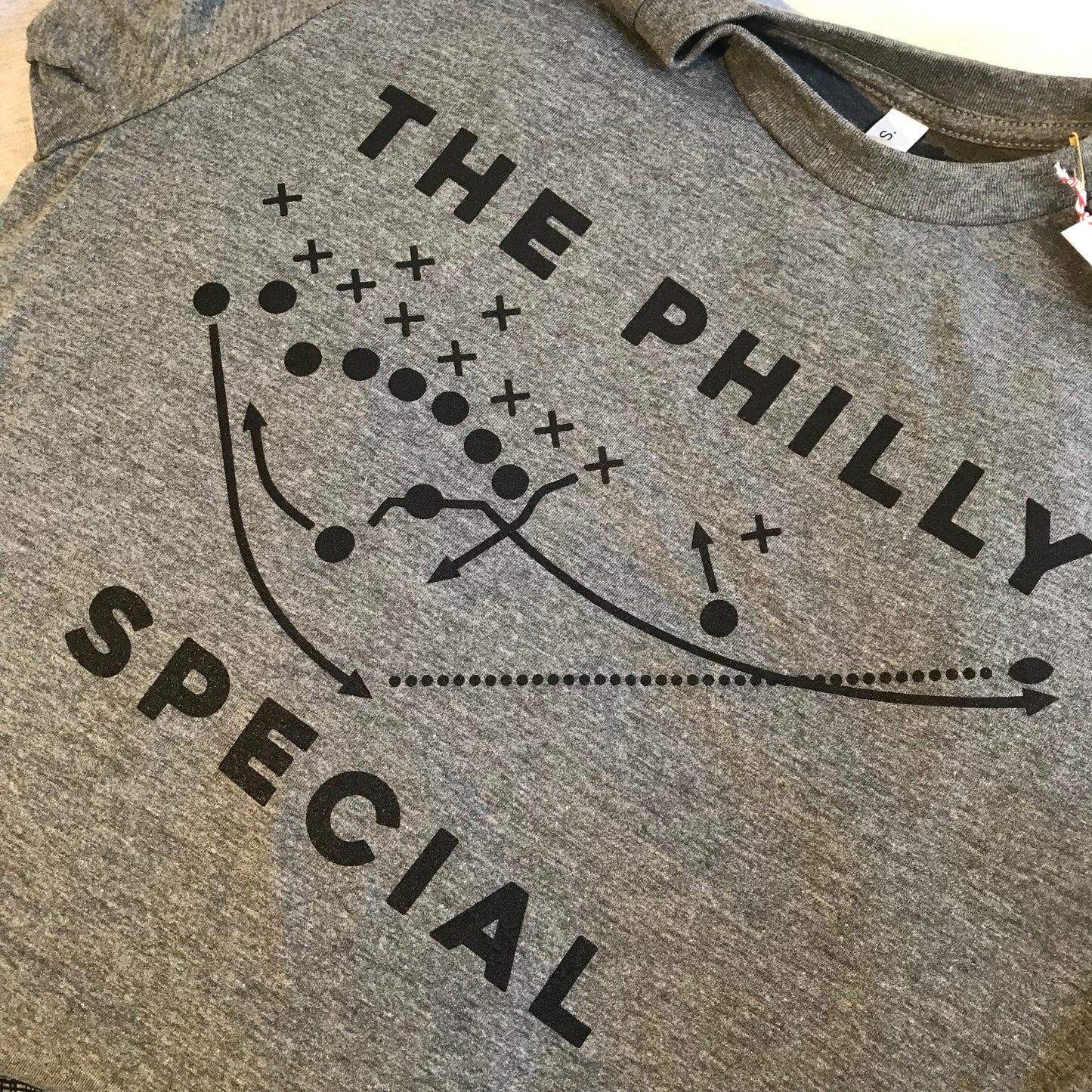 Gray Philly Special T-Shirt with "the Philly Special" text and a graphic depicting a football play diagram famously executed by Nick Foles during the Super Bowl by exit343design.